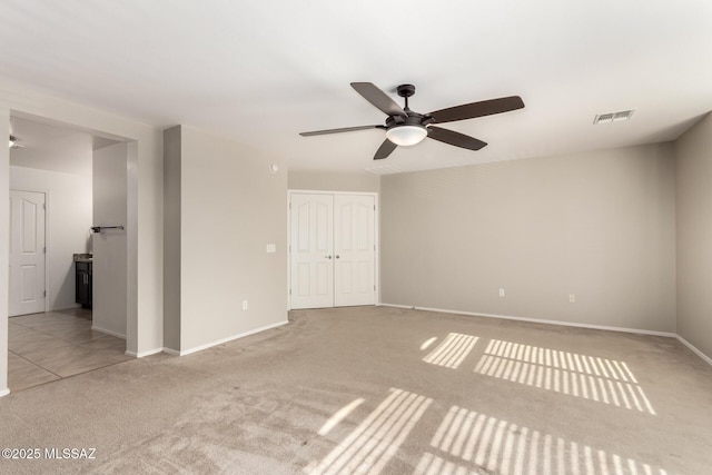 6733 S Stone Fly Dr, Tucson, AZ 85757 - empty room with light carpet, ceiling fan, and baseboards