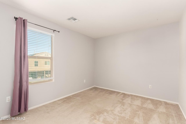 6733 S Stone Fly Dr, Tucson, AZ 85757 - spare room featuring light colored carpet and baseboards