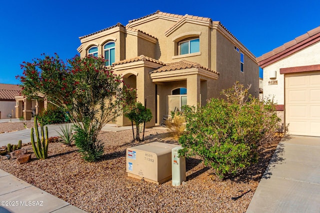 6733 S Stone Fly Dr, Tucson, AZ 85757 - view of front of house with stucco siding, a tile roof, a garage, and concrete driveway