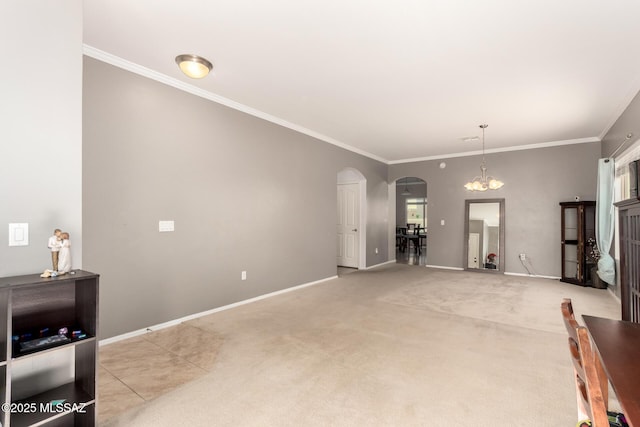 6733 S Stone Fly Dr, Tucson, AZ 85757 - unfurnished living room with arched walkways, ornamental molding, baseboards, and light carpet