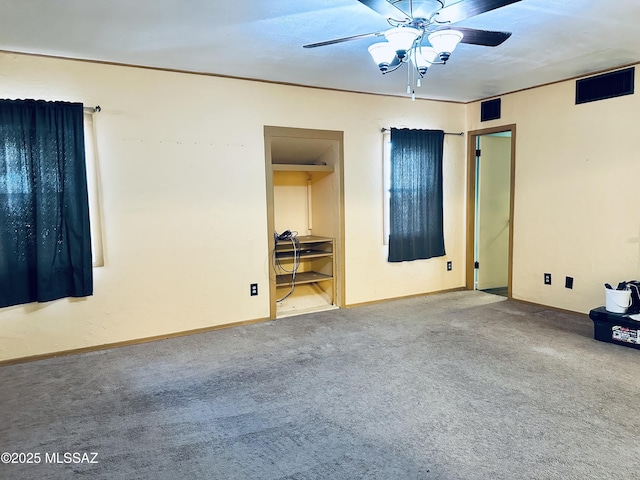 41 S Main St, Pima, AZ 85543 - carpeted empty room with a ceiling fan and baseboards