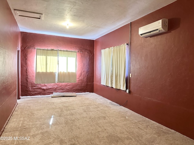 41 S Main St, Pima, AZ 85543 - unfurnished room with carpet flooring, a wall mounted air conditioner, and a textured wall