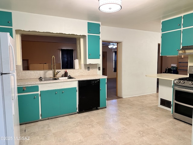41 S Main St, Pima, AZ 85543 - kitchen featuring black dishwasher, double oven range, a sink, freestanding refrigerator, and backsplash