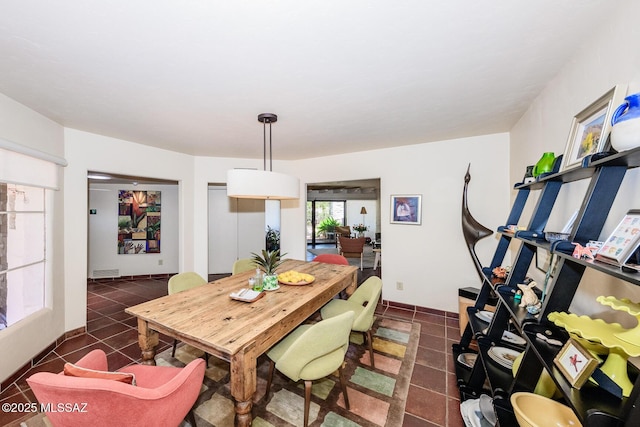 2600 E Skyline Dr Unit 21, Tucson, AZ 85718 - dining space featuring dark tile patterned floors
