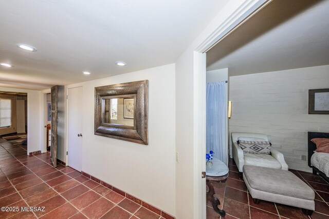2600 E Skyline Dr Unit 21, Tucson, AZ 85718 - corridor with recessed lighting, dark tile patterned floors, and baseboards