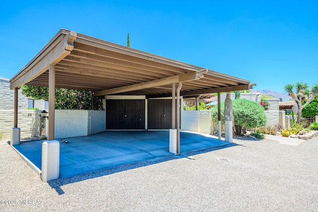 2600 E Skyline Dr Unit 21, Tucson, AZ 85718 - view of parking / parking lot featuring driveway and a carport