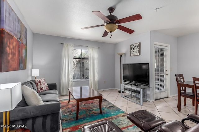 5751 N Kolb Rd Unit 25203, Tucson, AZ 85750 - living area with ceiling fan, light tile patterned flooring, and baseboards