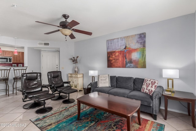 5751 N Kolb Rd Unit 25203, Tucson, AZ 85750 - living area featuring light tile patterned floors and a ceiling fan