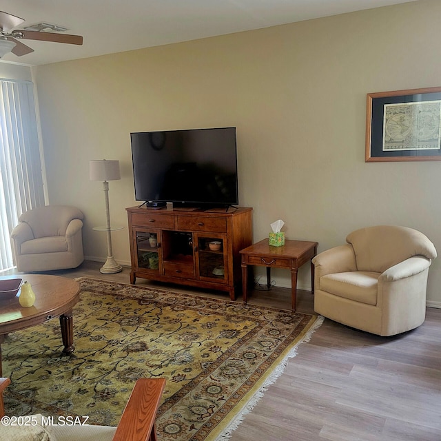 536 W Deerview Ct, Green Valley, AZ 85614 - living area with wood finished floors, ceiling fan, and baseboards