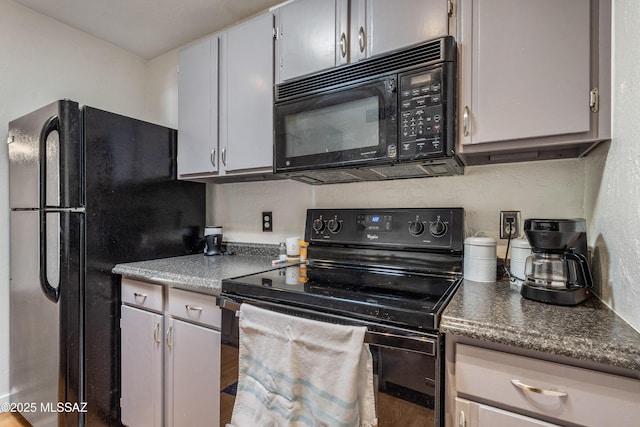 625 S Prudence Rd Apt 201, Tucson, AZ 85710 - kitchen featuring black appliances, dark countertops, and a textured wall