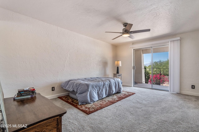 625 S Prudence Rd Apt 201, Tucson, AZ 85710 - carpeted bedroom with access to exterior, a textured wall, baseboards, a ceiling fan, and a textured ceiling