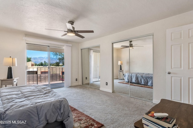 625 S Prudence Rd Apt 201, Tucson, AZ 85710 - bedroom with access to outside, two closets, carpet floors, a ceiling fan, and a textured ceiling
