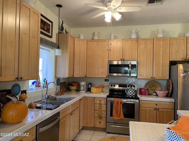 1606 N Panorama Way, Cochise, AZ 85606 - kitchen featuring stainless steel appliances, tile countertops, a sink, and a ceiling fan
