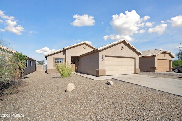 8079 N Eve Ann Way, Tucson, AZ 85741 - single story home featuring stucco siding, a garage, driveway, and a tiled roof