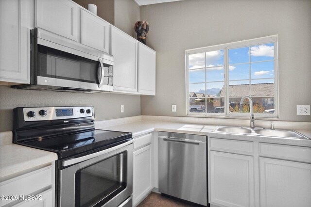 8079 N Eve Ann Way, Tucson, AZ 85741 - kitchen featuring appliances with stainless steel finishes, a sink, white cabinetry, and light countertops