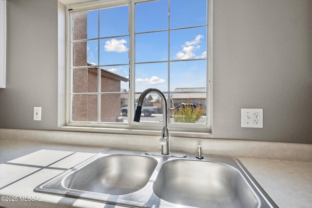 8079 N Eve Ann Way, Tucson, AZ 85741 - kitchen view of a sink and a textured wall