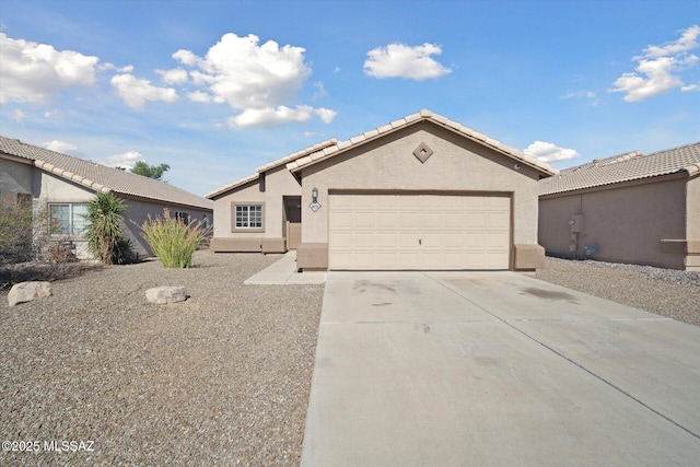 8079 N Eve Ann Way, Tucson, AZ 85741 - ranch-style house featuring stucco siding, concrete driveway, a garage, and a tile roof