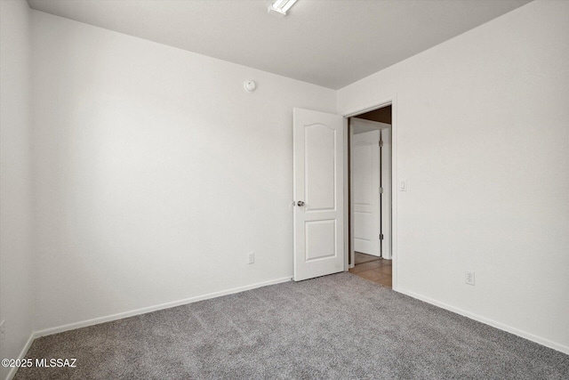 8079 N Eve Ann Way, Tucson, AZ 85741 - carpeted spare room featuring baseboards and a smoke detector