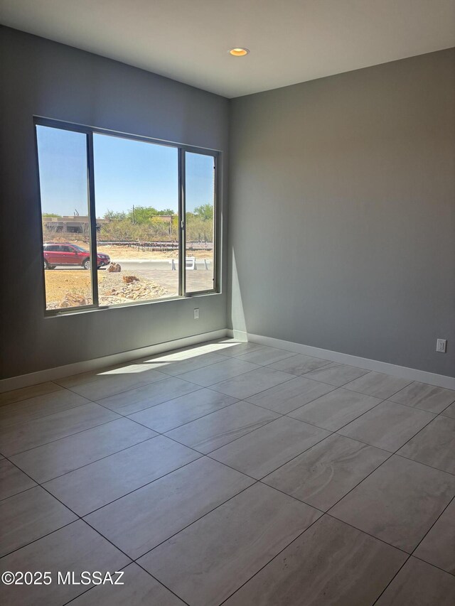 12710 N Sonoran Preserve Blvd Lot 24, Marana, AZ 85658 - tiled empty room with recessed lighting and baseboards