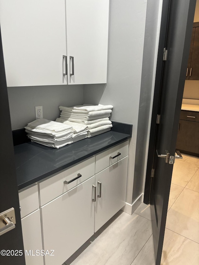 12710 N Sonoran Preserve Blvd Lot 24, Marana, AZ 85658 - kitchen featuring dark countertops, freestanding refrigerator, and white cabinetry