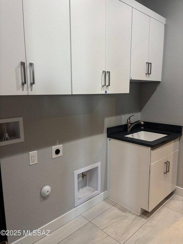12710 N Sonoran Preserve Blvd Lot 24, Marana, AZ 85658 - laundry room featuring baseboards, electric dryer hookup, hookup for a washing machine, and cabinet space