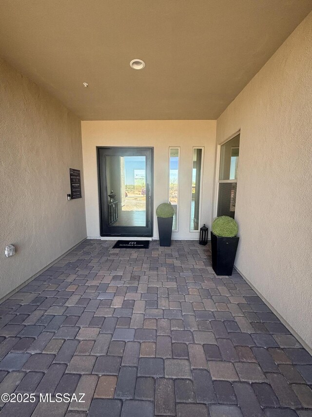12710 N Sonoran Preserve Blvd Lot 24, Marana, AZ 85658 - property entrance featuring stucco siding and a patio