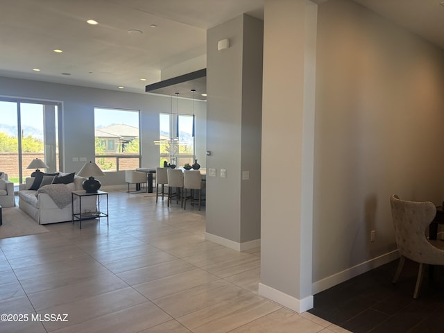 12710 N Sonoran Preserve Blvd Lot 24, Marana, AZ 85658 - living area with recessed lighting, plenty of natural light, and baseboards