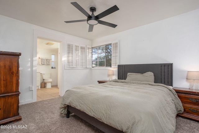 4308 E Elmwood St, Tucson, AZ 85711 - bedroom featuring carpet, a ceiling fan, connected bathroom, and tile patterned flooring