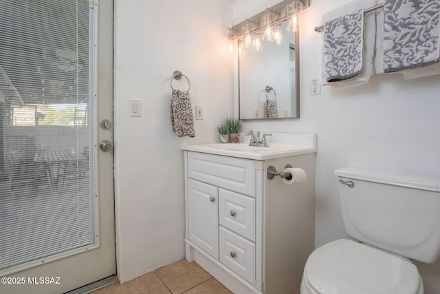 4308 E Elmwood St, Tucson, AZ 85711 - bathroom with vanity, tile patterned floors, and toilet