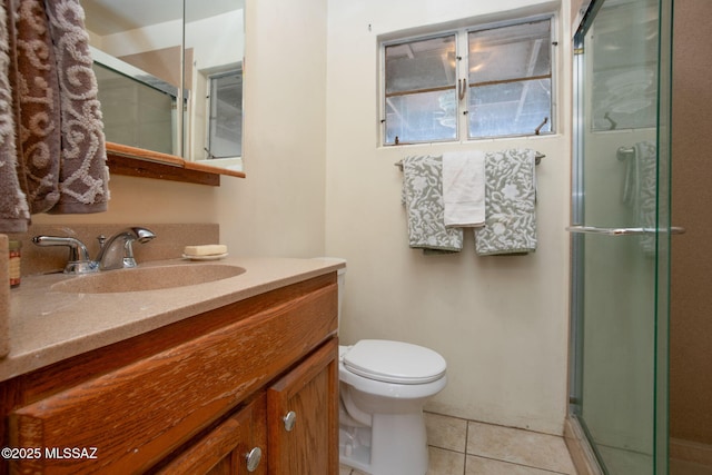 4308 E Elmwood St, Tucson, AZ 85711 - bathroom featuring vanity, a stall shower, tile patterned flooring, and toilet