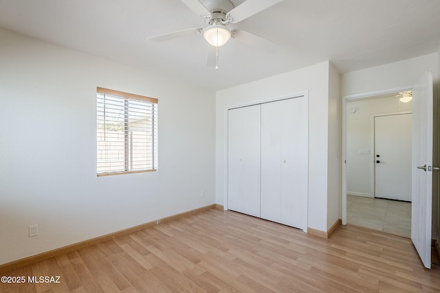9415 E Simon Pl, Tucson, AZ 85710 - unfurnished bedroom with light wood-style floors, a closet, and ceiling fan