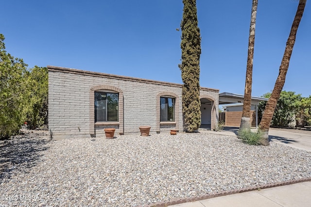 9415 E Simon Pl, Tucson, AZ 85710 - view of front of home with driveway and brick siding
