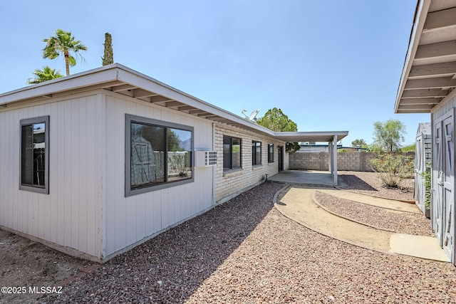 9415 E Simon Pl, Tucson, AZ 85710 - view of home's exterior with a patio area