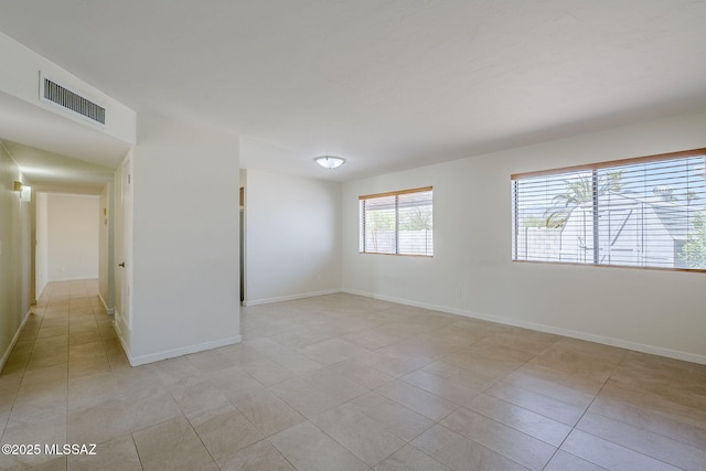 9415 E Simon Pl, Tucson, AZ 85710 - empty room featuring light tile patterned flooring