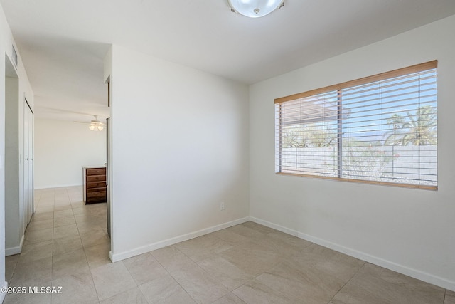 9415 E Simon Pl, Tucson, AZ 85710 - spare room with light tile patterned flooring and ceiling fan