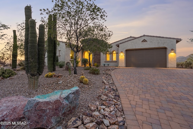 12475 N Faraway Wash Trl, Marana, AZ 85658 - view of front facade with a garage, stucco siding, and driveway