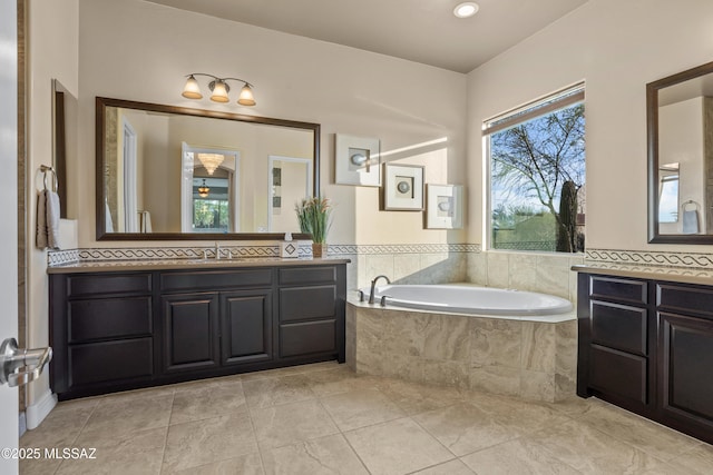 12475 N Faraway Wash Trl, Marana, AZ 85658 - bathroom featuring a bath, two vanities, and tile patterned flooring