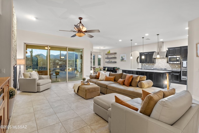 12475 N Faraway Wash Trl, Marana, AZ 85658 - living room featuring ceiling fan, light tile patterned flooring, recessed lighting, and a mountain view