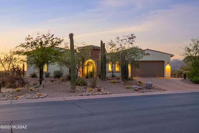 12475 N Faraway Wash Trl, Marana, AZ 85658 - view of front facade featuring driveway, a garage, and stucco siding