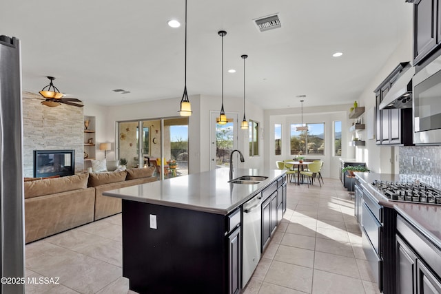 12475 N Faraway Wash Trl, Marana, AZ 85658 - kitchen with appliances with stainless steel finishes, ceiling fan, light tile patterned flooring, pendant lighting, and recessed lighting
