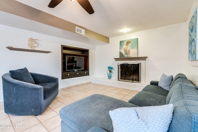 4990 N Kolb Rd, Tucson, AZ 85750 - tiled living room featuring ceiling fan and a brick fireplace