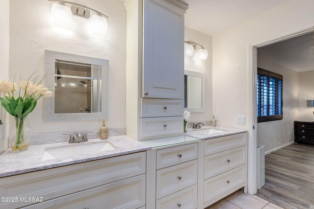 4990 N Kolb Rd, Tucson, AZ 85750 - bathroom featuring double vanity and a shower stall