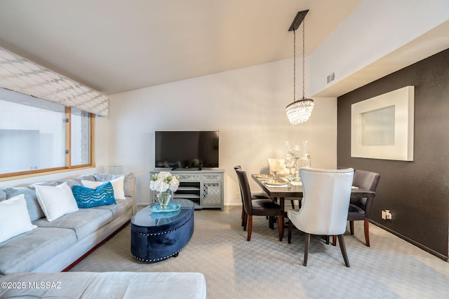 4990 N Kolb Rd, Tucson, AZ 85750 - carpeted living area featuring baseboards and a chandelier
