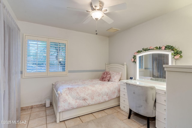 4990 N Kolb Rd, Tucson, AZ 85750 - bedroom with light tile patterned floors, a ceiling fan, and a desk