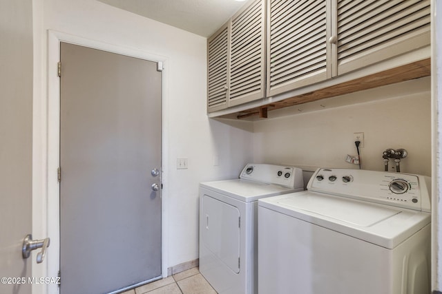4990 N Kolb Rd, Tucson, AZ 85750 - laundry room with cabinet space, separate washer and dryer, and light tile patterned flooring