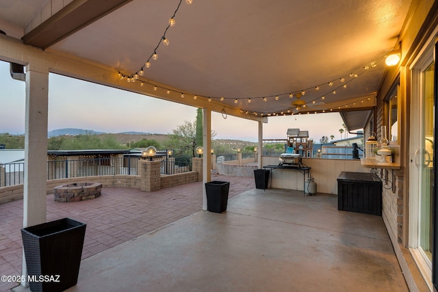 4990 N Kolb Rd, Tucson, AZ 85750 - view of patio with a fire pit, an outdoor kitchen, and a mountain view