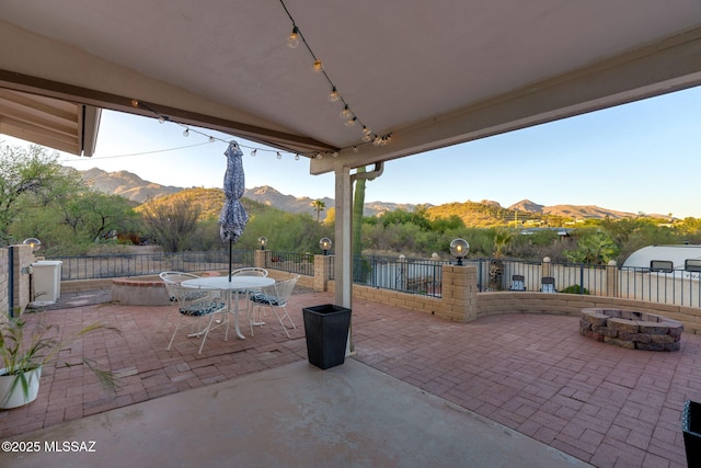 4990 N Kolb Rd, Tucson, AZ 85750 - view of patio / terrace featuring an outdoor fire pit, a mountain view, and outdoor dining space