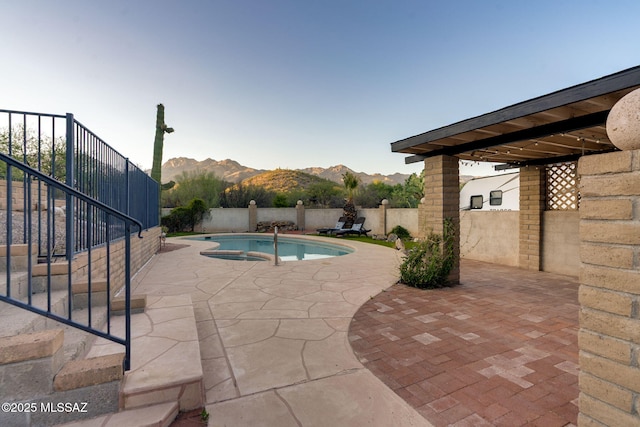 4990 N Kolb Rd, Tucson, AZ 85750 - view of swimming pool with a patio, a mountain view, stairway, a fenced backyard, and a pool with connected hot tub