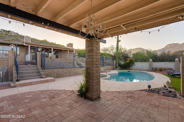 4990 N Kolb Rd, Tucson, AZ 85750 - view of swimming pool with a patio area, a mountain view, and a fenced backyard