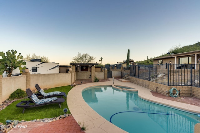 4990 N Kolb Rd, Tucson, AZ 85750 - pool at dusk with a fenced backyard and a pool with connected hot tub